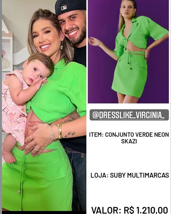 Mulher branca com roupas verde segurando um bebê