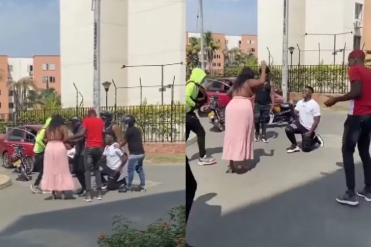 Foto colorida de uma mulher de vestido rosa e um homem - Metrópoles