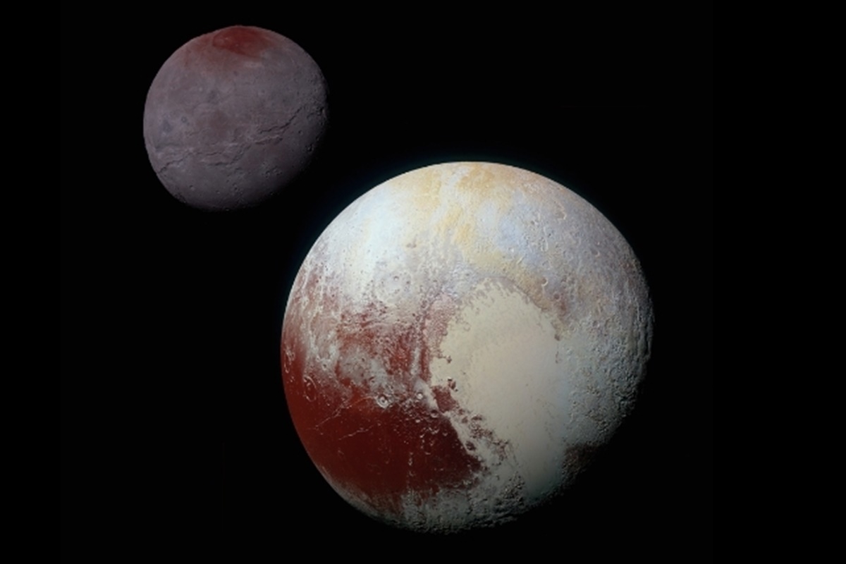 Imagem colorida de Plutão e Caronte - Metrópoles 