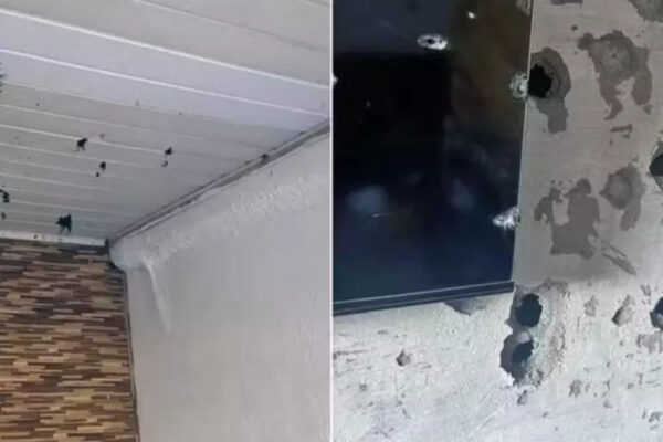 Imagem colorida, casa com diversos tiros