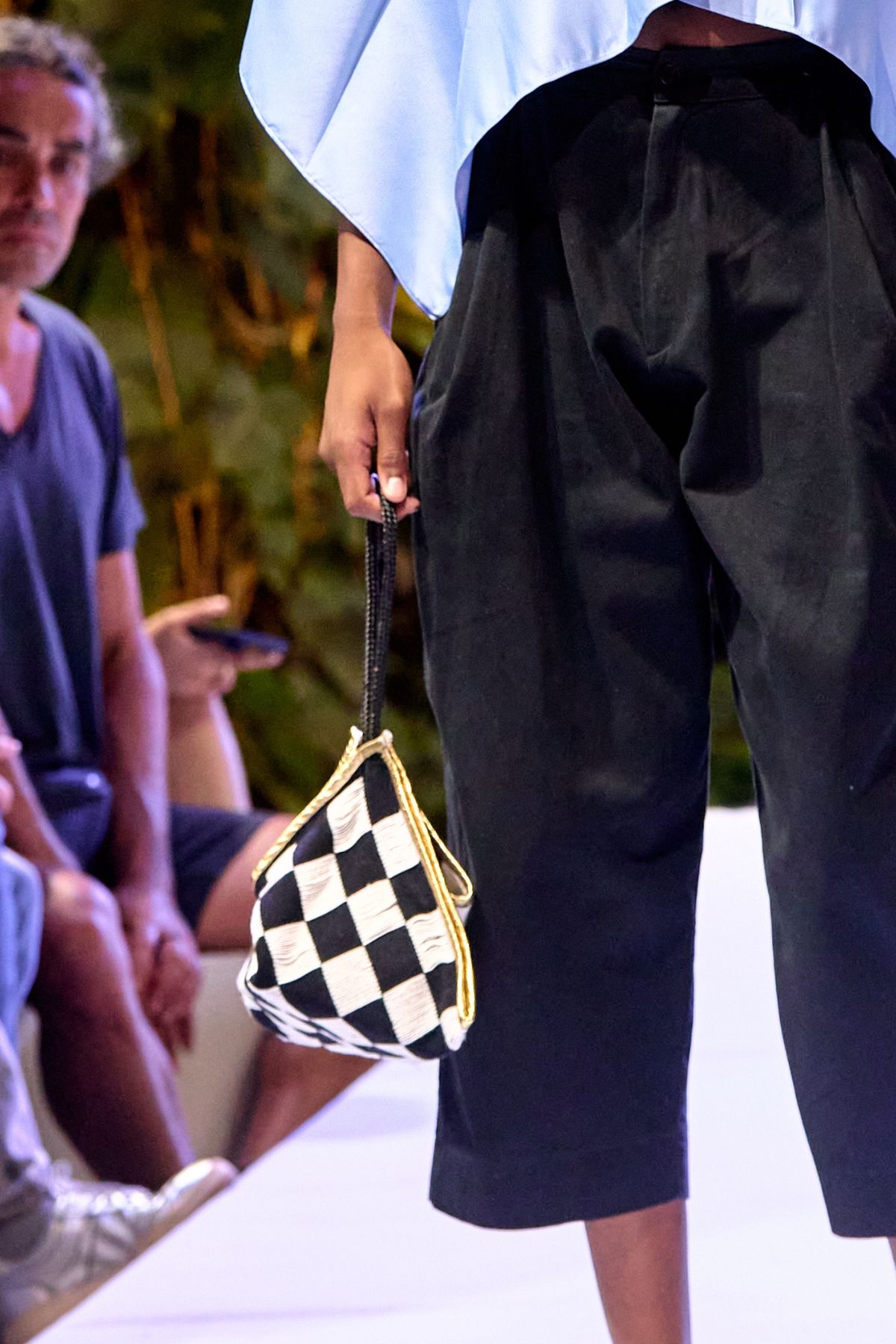 Color image of a model holding a bag